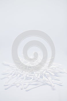 Vertical banner with cotton buds heap isolated on the white copy space background