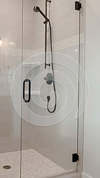 Vertical Bathroom shower stall with half glass enclosure adjacent to built in bathtub