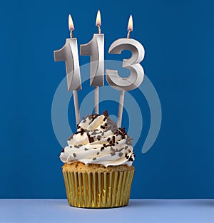 Vertical birthday card with cake - Lit candle number 113 on blue background