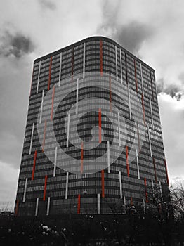 Vertical black and white skyscraper with red marks background