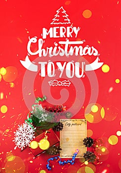 Vertical christmas banner with new year greetings, red background, gift and decorations, beautiful bokeh and sparkles