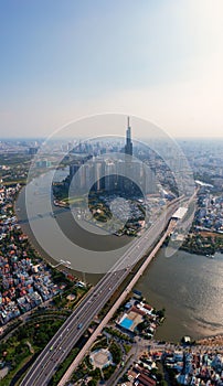 Vertical cityscape photo of Ho Chi Minh city and Saigon river