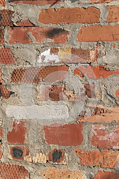 Vertical close up image of red brick wall