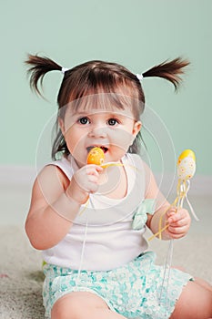 Vertical close up indoor easter portrait of cute happy baby girl