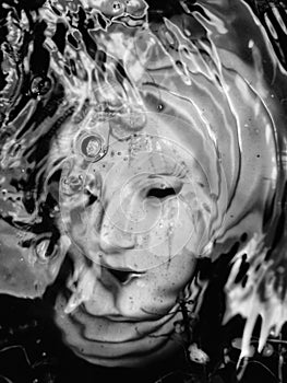 Vertical closeup of the Ophelia sculpture in a water