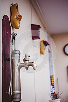 Vertical closeup shot of an antique sink in a room