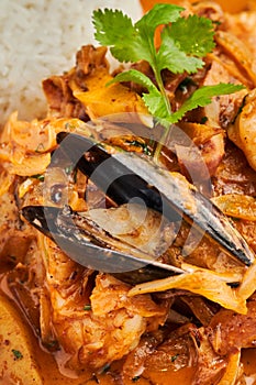 Vertical closeup shot of a delicious seafood mussel dish