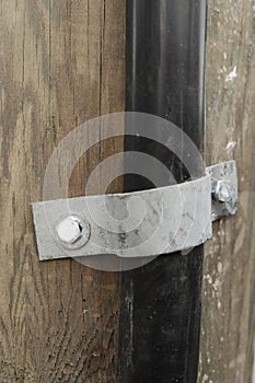 Vertical closeup shot of a door metal hinges