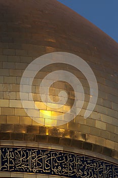 Vertical closeup shot of the golden dome of the Sayidah Zaynab Mosque, Zaynab, Syria