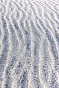 Vertical closeup shot of gypsum sand dunes at White Sands National Park, New Mexico