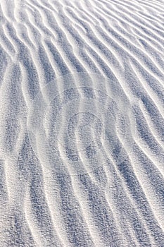 Vertical closeup shot of gypsum sand dunes at White Sands National Park, New Mexico