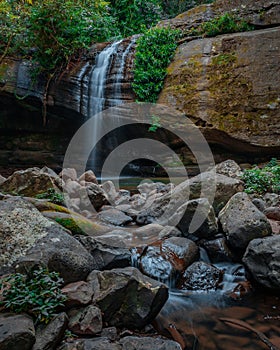 Vertical closeup of a small waterfall in the Buderim forest park, Australia