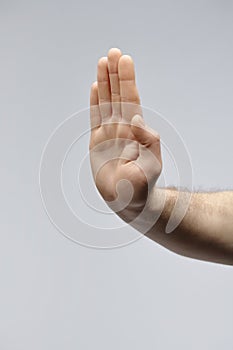 Male Hand Showing Stop Gesture