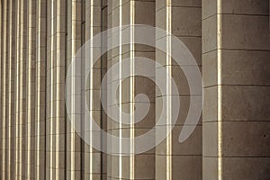 Vertical columns of the facade of a modern building as background