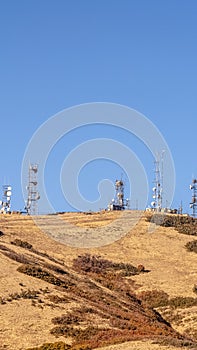 Vertical Communication towers on a mountain top day light