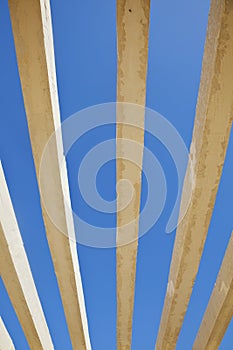 Vertical concrete shapes on a rich blue sky