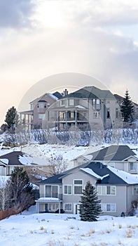 Vertical crop Houses on snowy setting in winter with magnificent view of Wasatch Mountain