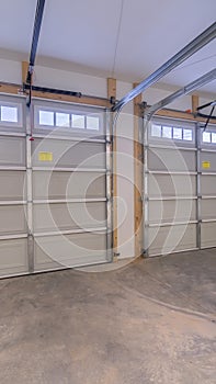 Vertical crop Inside an empty double vehicle garage interior