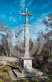 Vertical of cross of the Romero in the forest of the Herreria in San Lorenzo de El Escorial, Spain