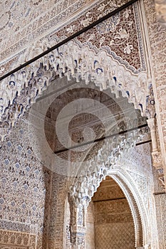 Vertical of the details of Arab and Nasrid architecture in the Alhambra palace in Granada, Spain.