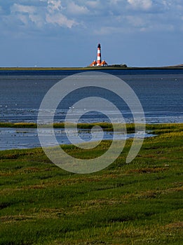 Vertical distant shot of famous Westerhever lighthouse located in St. Peter-Ording, Germany