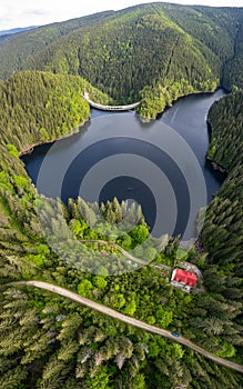 Vertical drone panorama of a lake within mountains