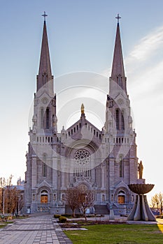 Vertical early morning view of the 1926 roman catholic Beaux-Arts style Basilica of Sainte-Anne-de-BeauprÃ©