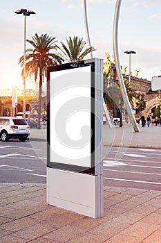 Vertical empty billboard placeholder template on the city bus stop, information banner template, space for mockup layout.