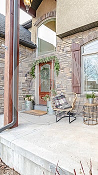 Vertical Exterior patio with two wicker comfy chairs