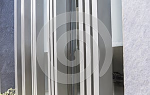 Vertical Extruded aluminum window frames and glass curtain wall - architectural element for the exterior design of a house photo