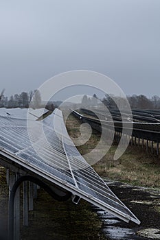 Vertical of a field of solar panels on a cloudy day in the countryside in Germany
