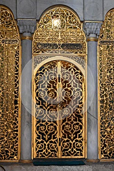 Vertical of Filigree gilded arch in the ancient Hagia Sophia mosque in Istanbul, Turkey