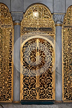 Vertical of Filigree gilded arch in the ancient Hagia Sophia mosque in Istanbul, Turkey