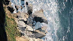 Vertical footage of further most northern point of Spain. Rocky cape and waves of the Atlantic Ocean.