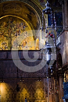 Vertical: Foreground of incense burner and Tree of Jesse mosaic inside St. Mark`s Balsica in Venice.