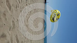 Vertical format time lapse parasailing wing flying in wind