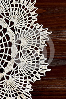 Vertical fragment of a vintage ivory crochet doily