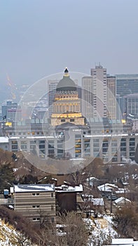 Vertical frame Panoramic view of the bustling Salt Lake City downtown on a cloudy winter day