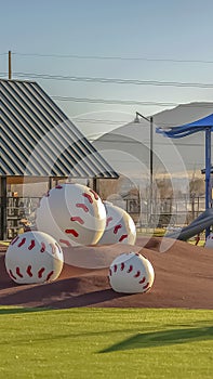 Vertical frame Park with a variety of playground equipment and structures viewed on a sunny day