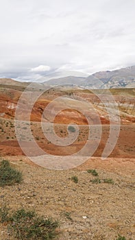 The vertical frame. Red landscape of the Kyzyl-Chin in the Altai. Altai Mars in the summer. Sand, clay, stones