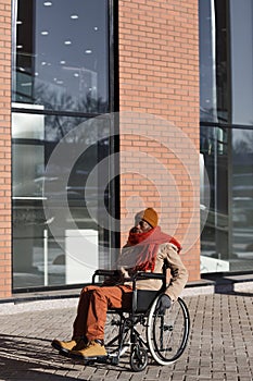 Contemporary Wheelchair User Outdoors in City