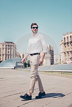 Vertical full-length portrait of serious handsome attractive virile masculine pensive foreigner wearing formal outfit white shirt