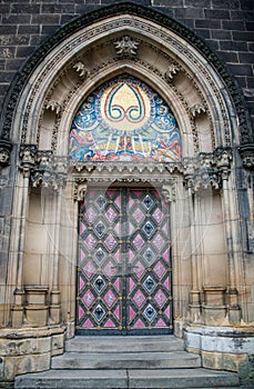 Vertical of a gothic entrance to the Saints Peter and Paul Basilica church in Prague.