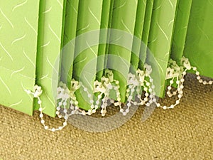 Vertical green blinds louvres louvre home furnishings decor decoration window fabric pleats cleats carpet modern fixtures fittings photo