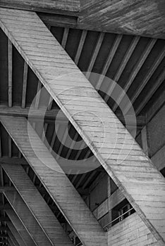 Vertical greyscale shot of an old attic with wooden ceiling