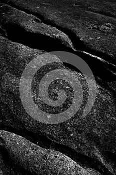 Vertical greyscale shot of rock formations - great for a cool background