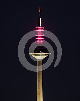 Vertical of the high telecommunication tower Europaturm in Frankfurt, Germany captured at night photo