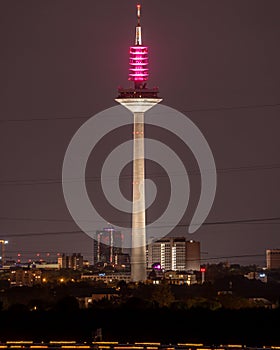 Vertical of the high telecommunication tower Europaturm in Frankfurt, Germany captured at night photo