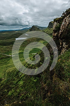 Vertical of hills and lake on Isle of Skie island in Scotland captured under a grey cloudy sky photo