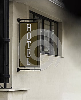 Vertical hotel sign text on billboard outdoor mock up neon sign informing passing people tourist pedestrian or car drivers photo